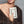 YLIANA YEPEZ Minaudiere. Rectangular clutch with gold frame and beige interior on a white background
