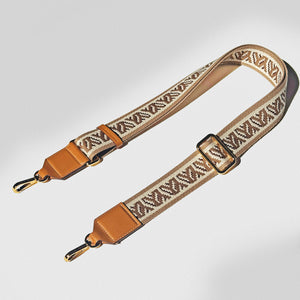 YY Decorative bag strap with camel and beige pattern on a off white background