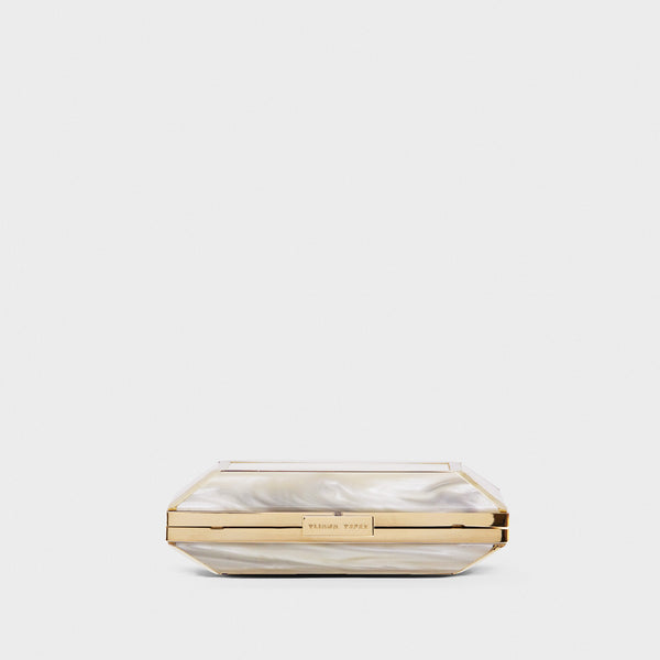 YLIANA YEPEZ Minaudiere. Rectangular clutch with gold frame and beige interior on a white background