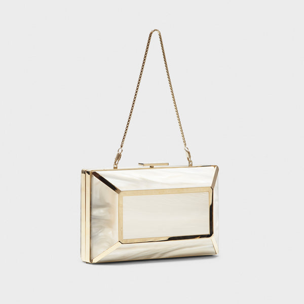 YLIANA YEPEZ Minaudiere. Rectangular clutch with gold frame and beige interior on a white background