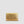 A gold-toned crocodile-embossed leather clutch or wallet, centered against a solid light gray background.