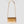 A gold crocodile-embossed leather crossbody bag with a matching gold chain strap and top handle, shown against a light gray background.