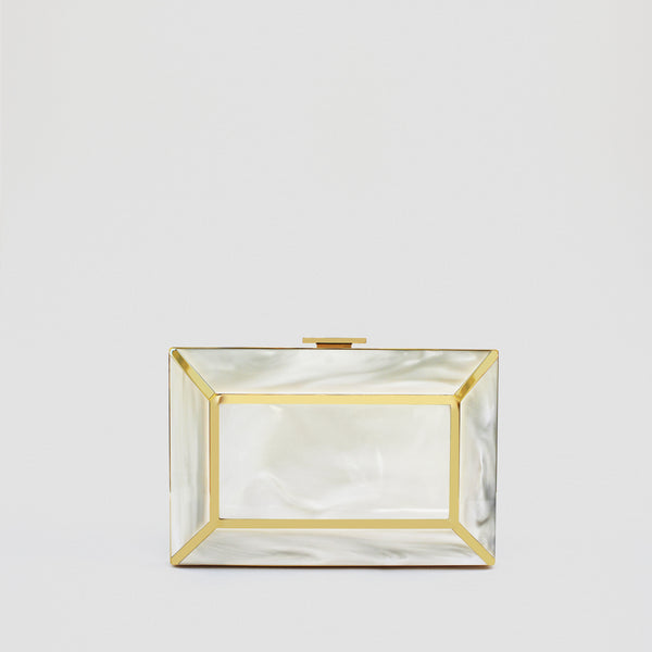 YLIANA YEPEZ Minaudiere. Rectangular clutch with gold frame and beige interior on a white background