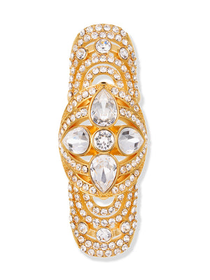 A gold-tone ring featuring a central floral clover motif set with clear marquise and round gemstones, surrounded by rows of small pavé-set clear stones, shown on a plain white background.