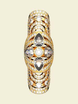 Gold ring with gemstones on a beige background